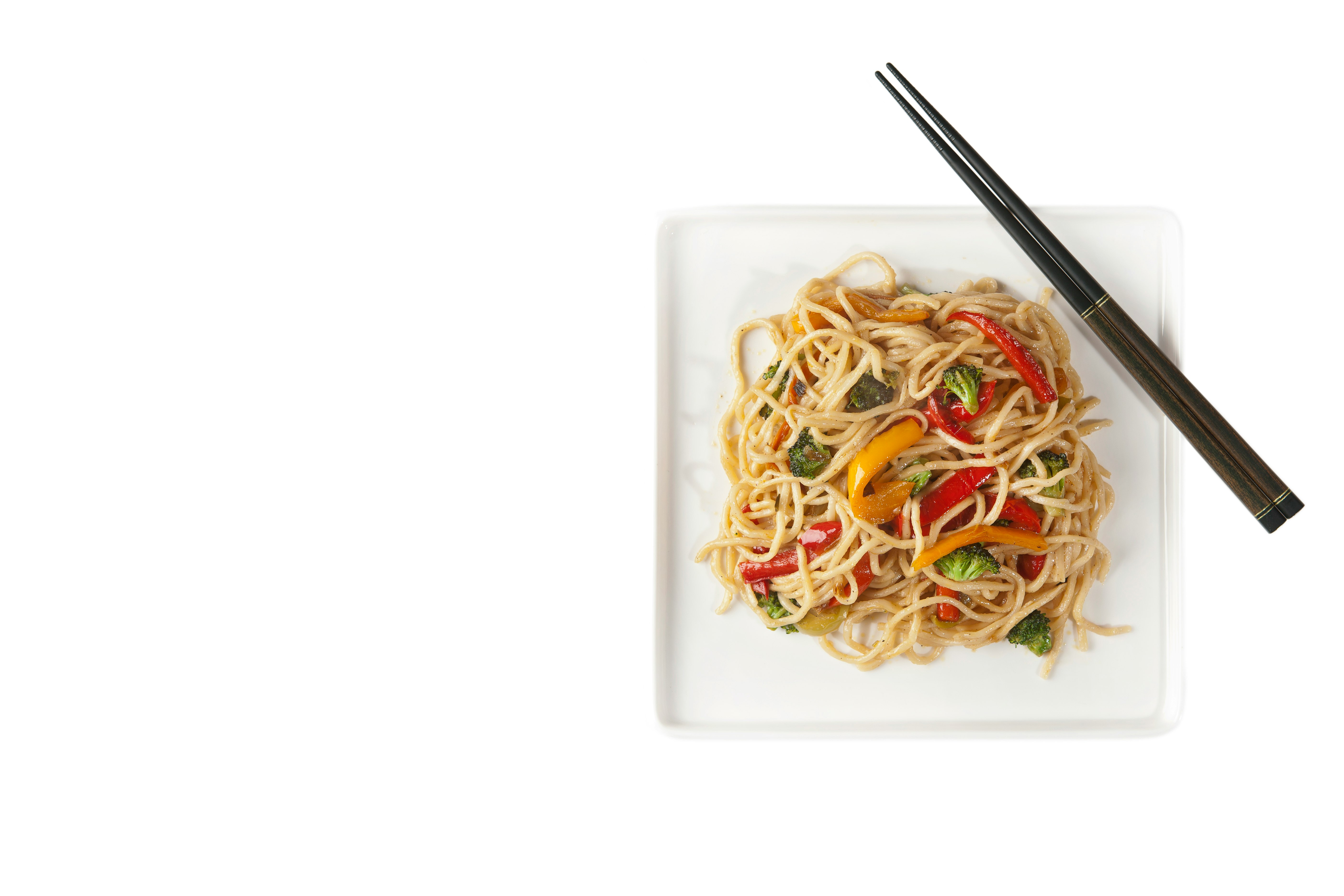 pasta with meat and vegetables in white ceramic plate